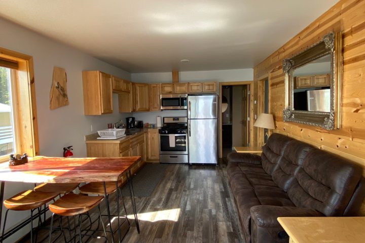 a living room filled with furniture on top of a wooden table