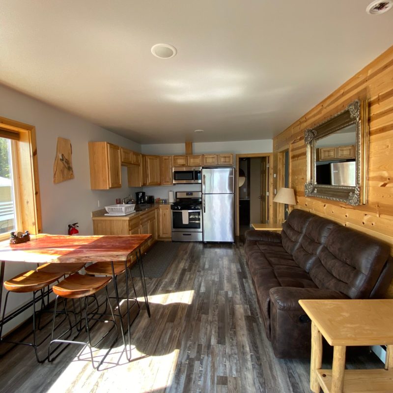 a living room filled with furniture on top of a wooden table