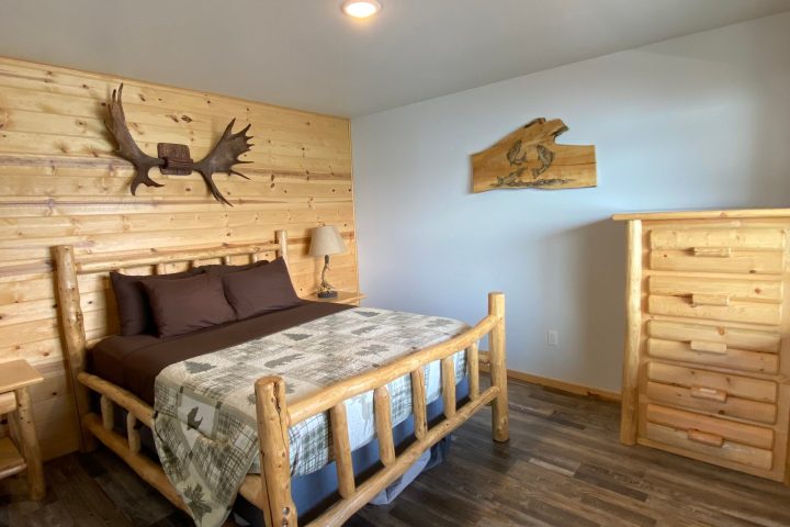 a bedroom with a wooden floor