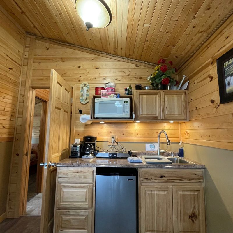 a stove top oven sitting inside of a kitchen