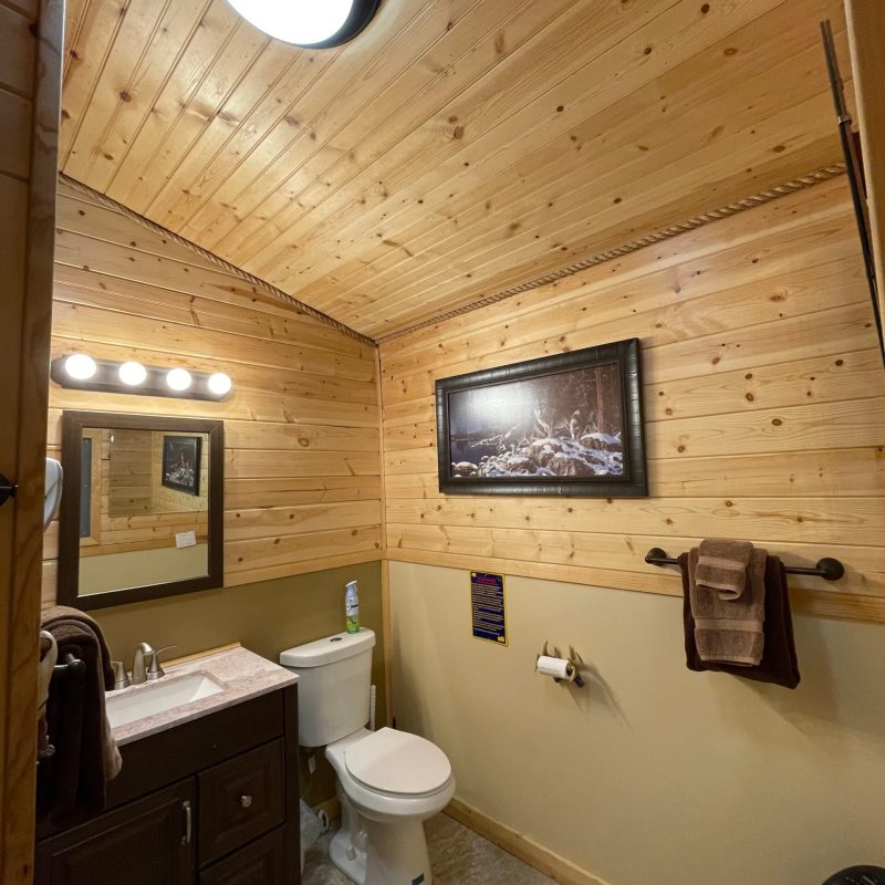 a room with a sink and a mirror