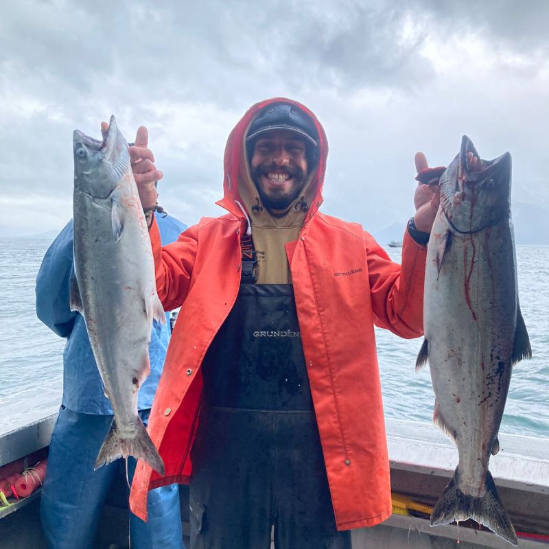 a person holding a fish