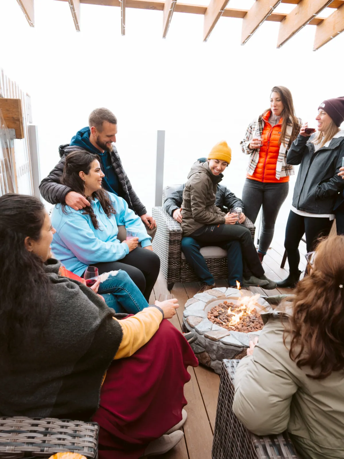 a group of people sitting in front of a building