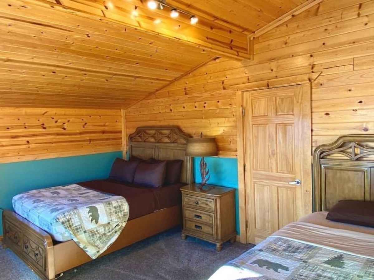 a bedroom with a bed in a room