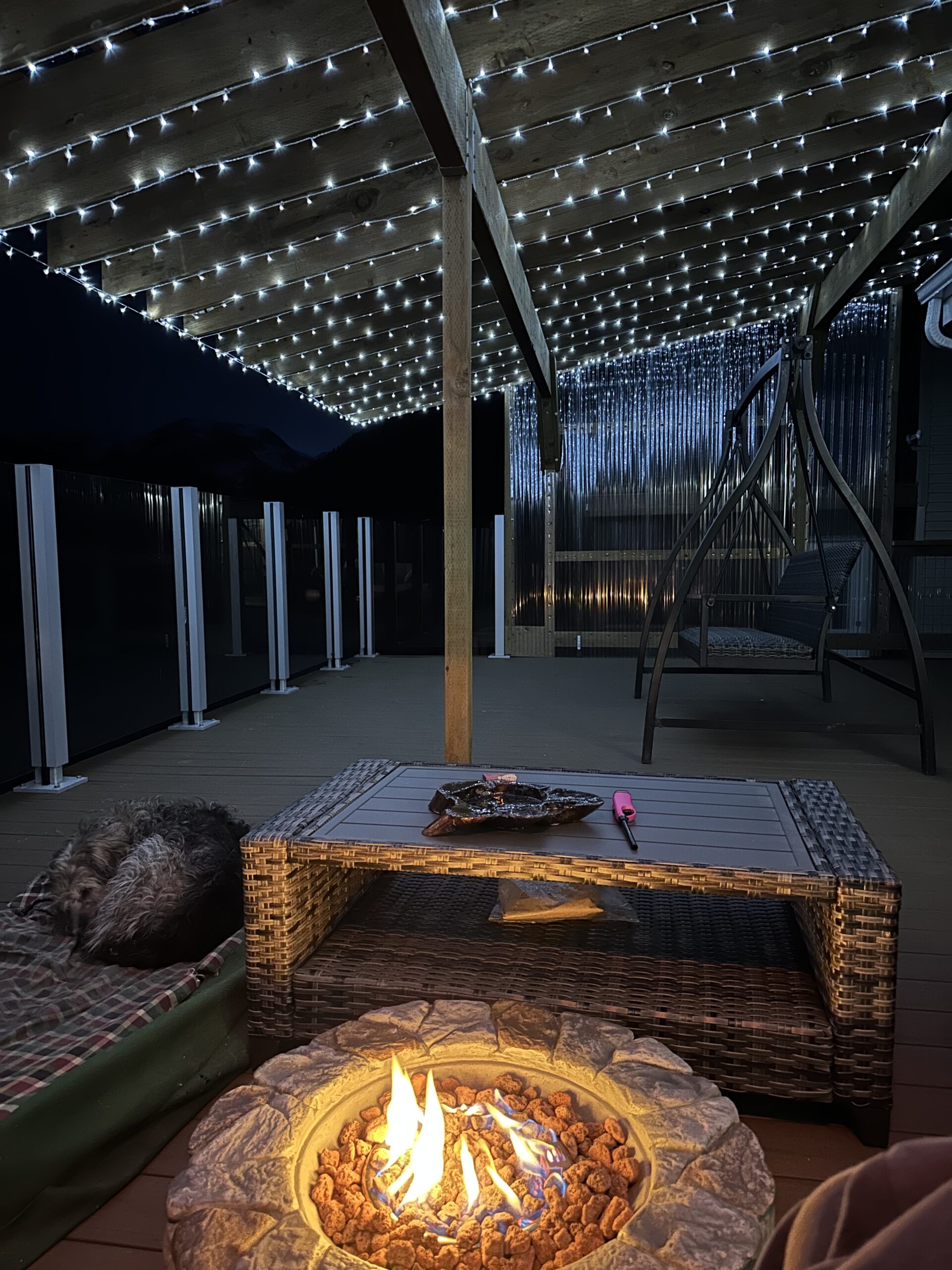 a chair sitting in front of a fence
