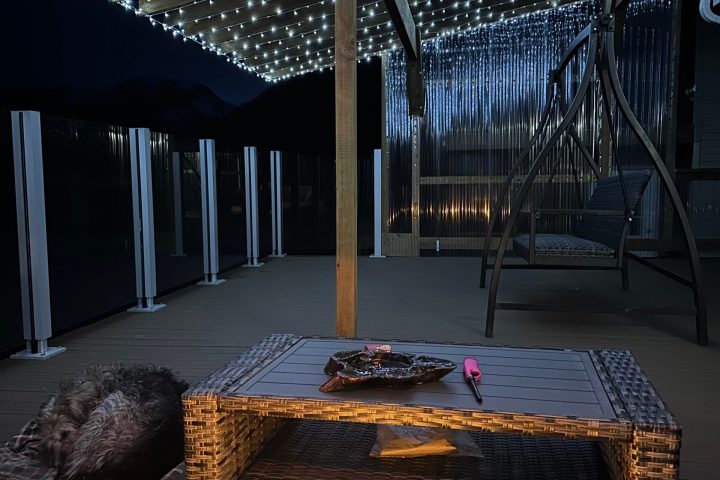 a chair sitting in front of a fence