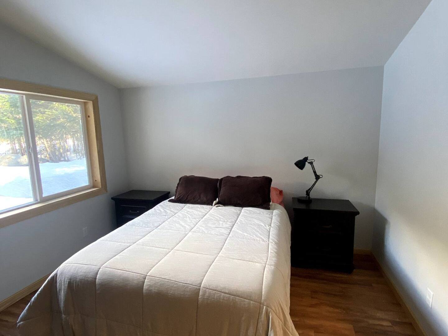 a bedroom with a bed in a room