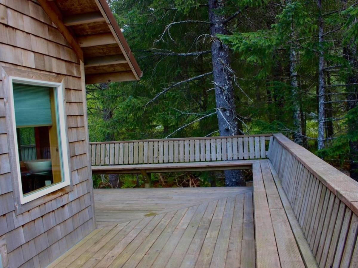 a wooden bench in the second level porch