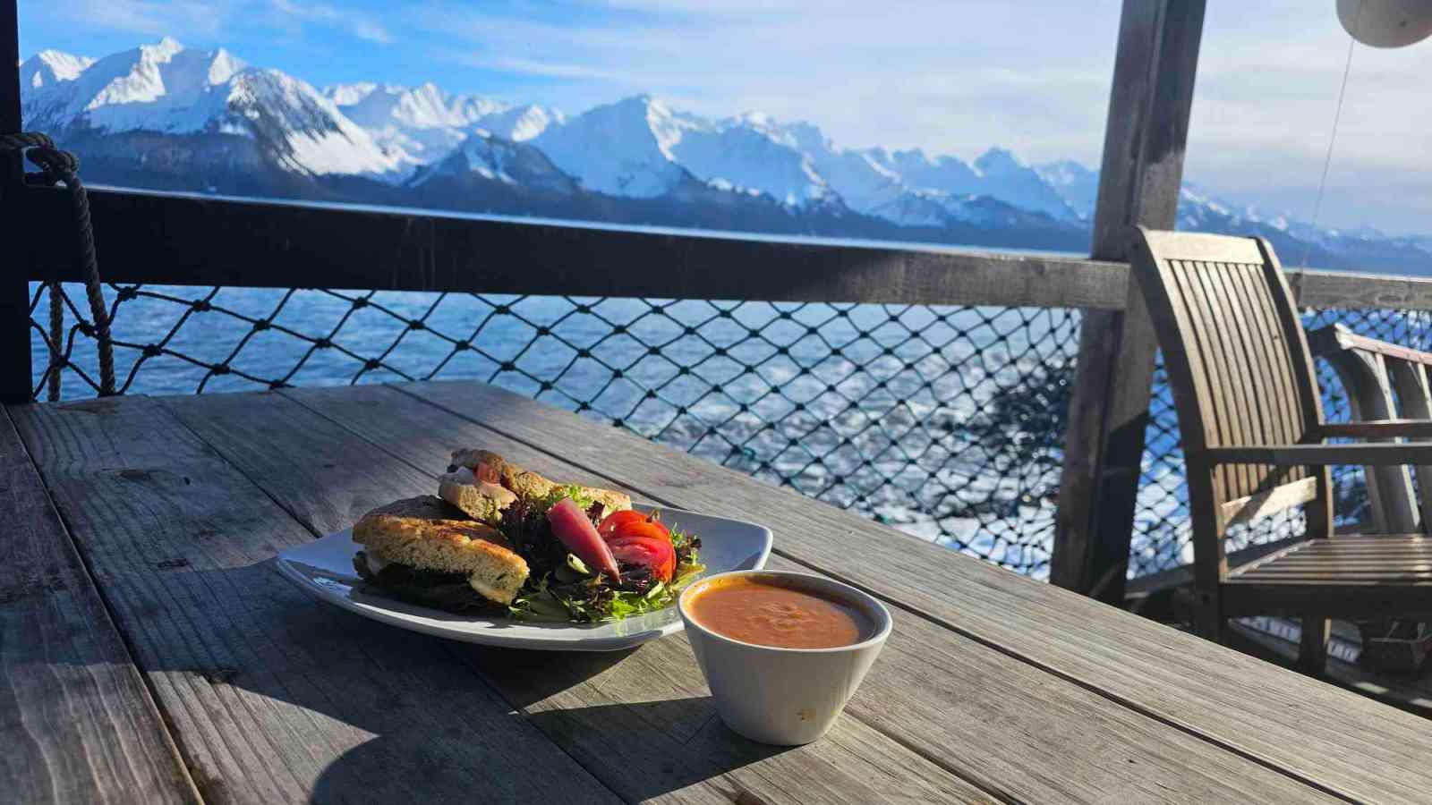 a close up of a picnic table in front of a mountain