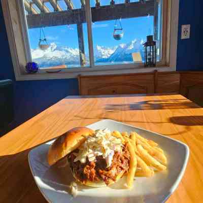 a plate of food sitting on top of a wooden table
