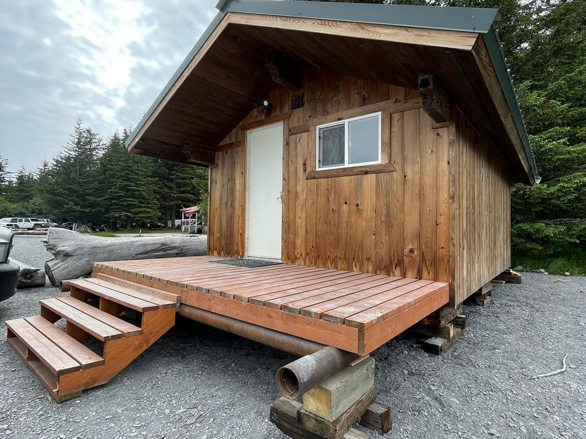 a wooden bench in front of a house