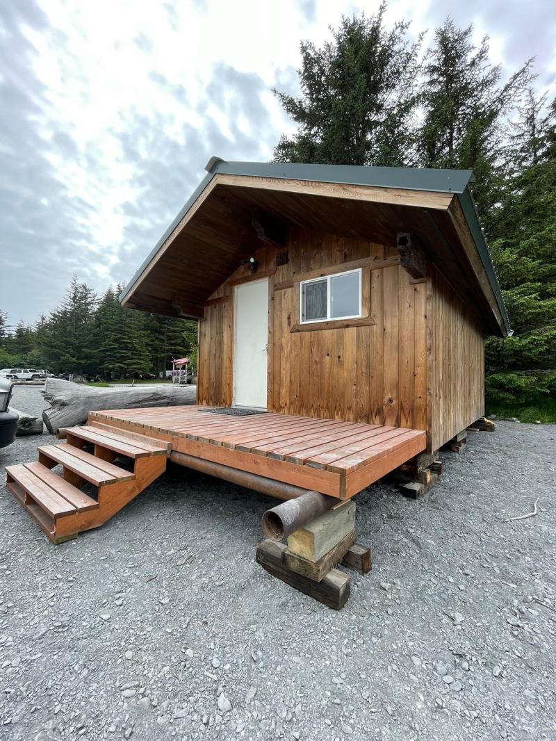 a wooden bench in front of a house