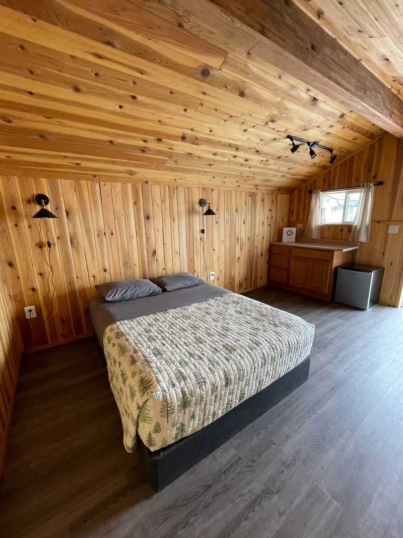 a bedroom with a bed in a room