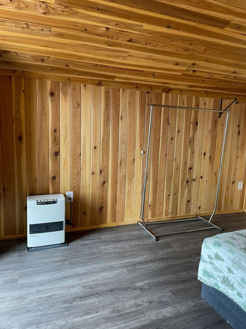 a bedroom with a bed in a room