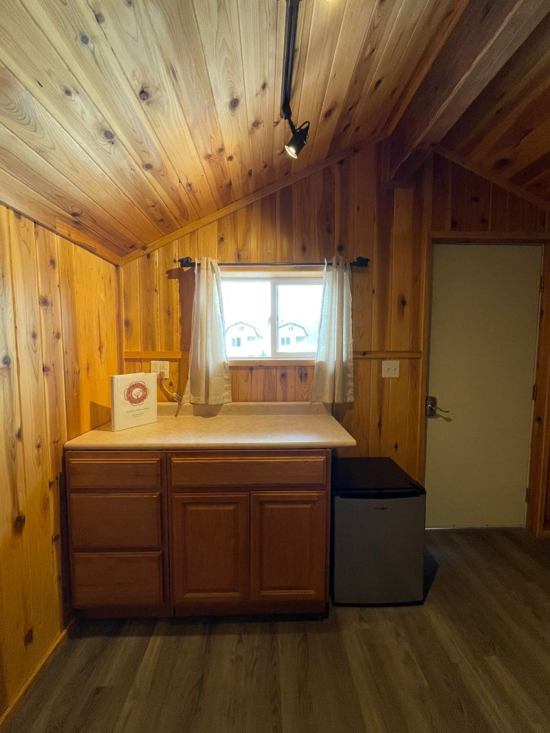 a kitchen with a wood floor