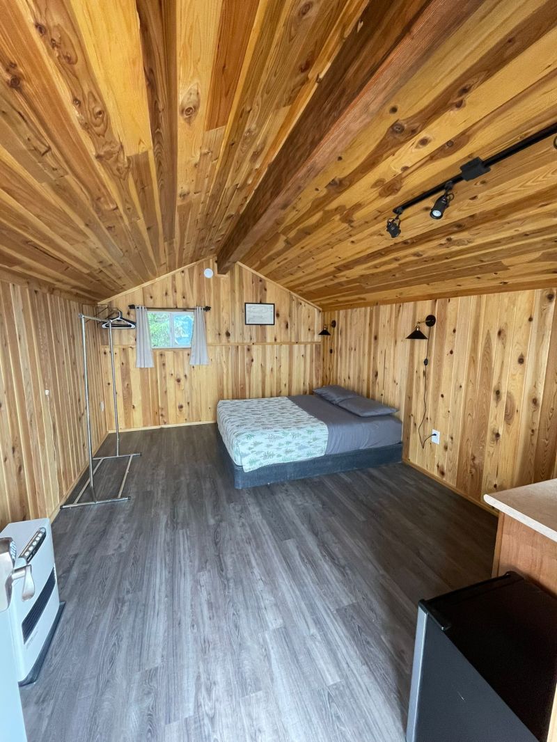 a bed with a wooden floor