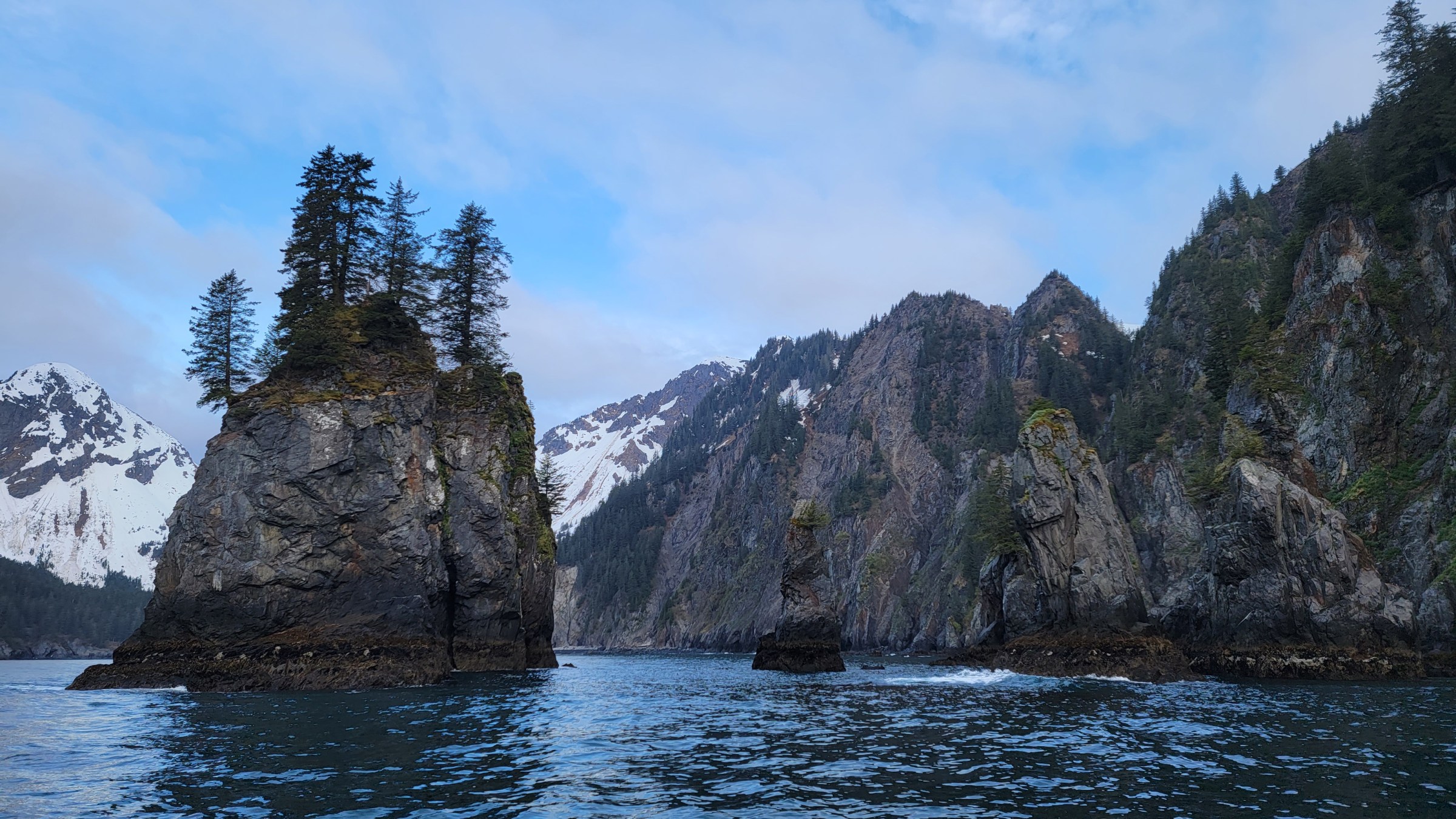 a large body of water with a mountain in the background
