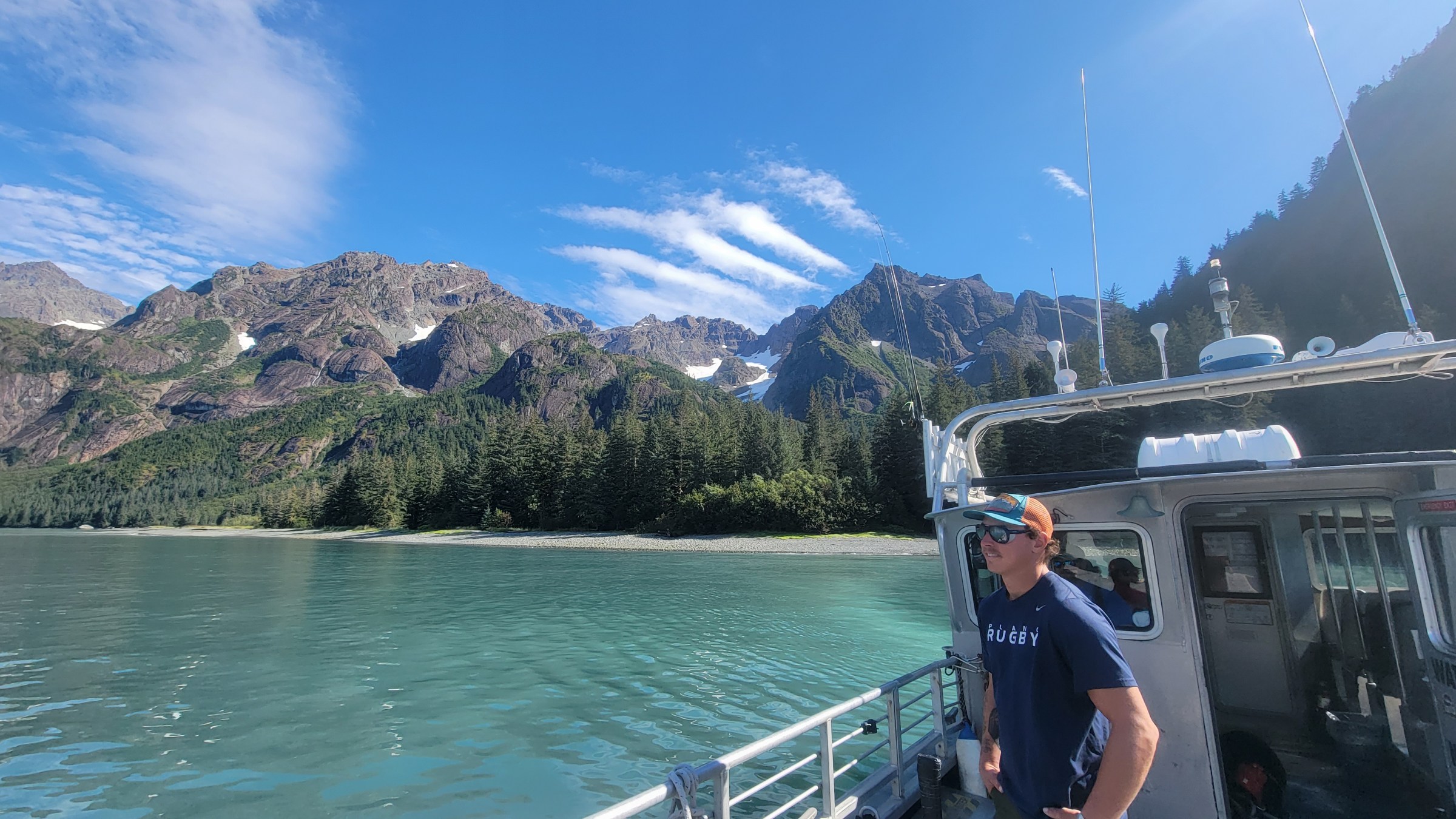 a man standing on a boat in the water