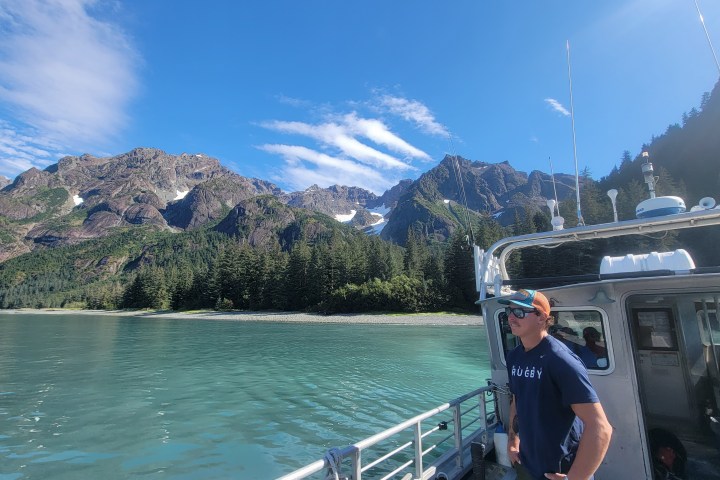 a man standing on a boat in the water