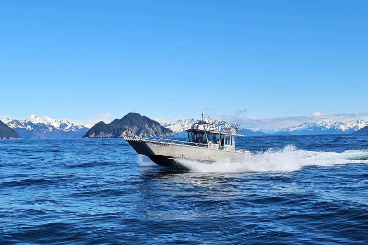 a man riding a wave on top of a body of water