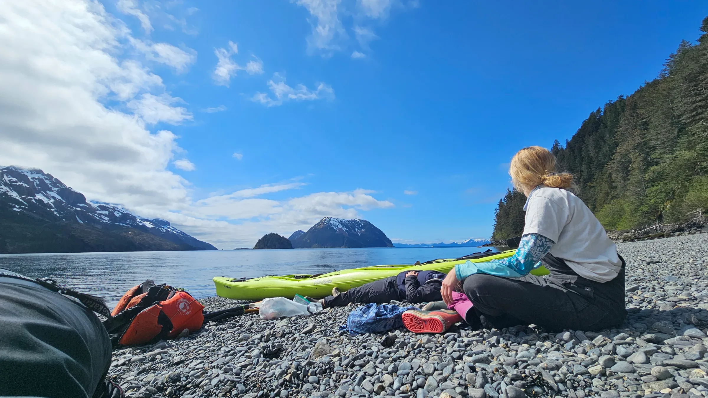 a person lying on top of a mountain