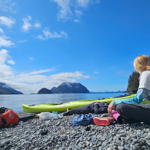 a person lying on top of a mountain