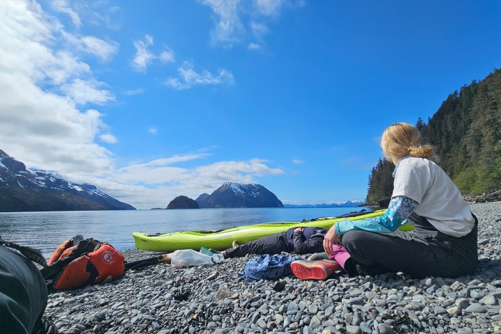 a person lying on top of a mountain