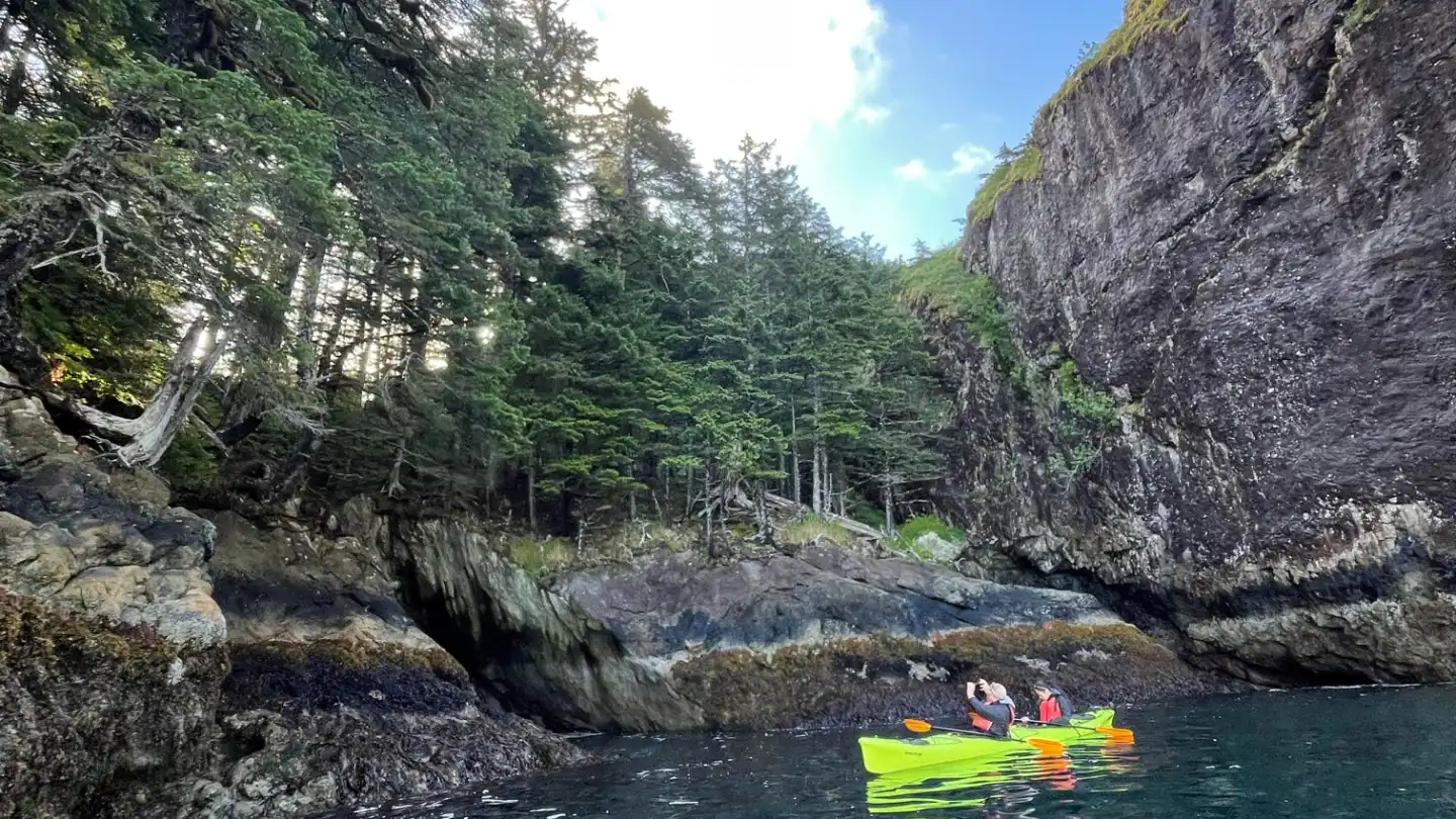 a body of water with a mountain in the background