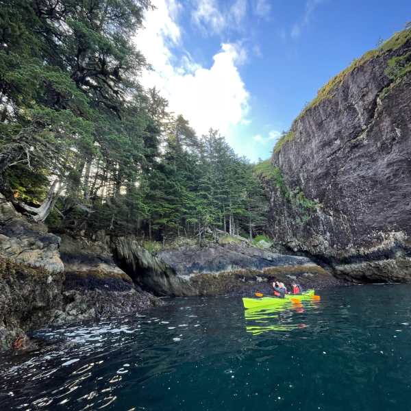 a body of water with a mountain in the background