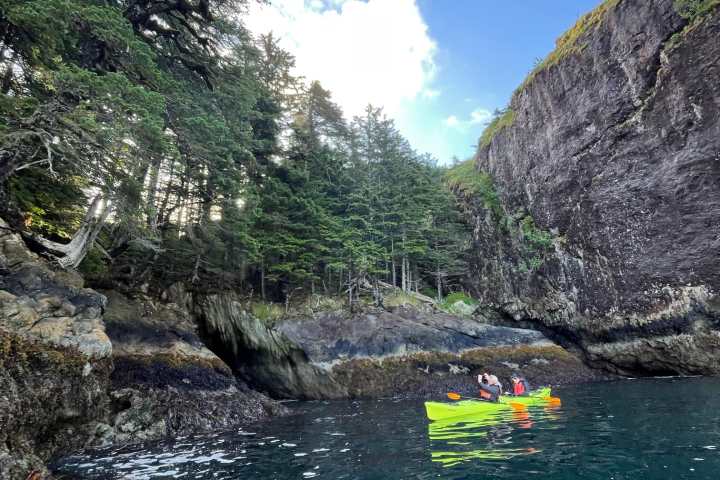 a body of water with a mountain in the background