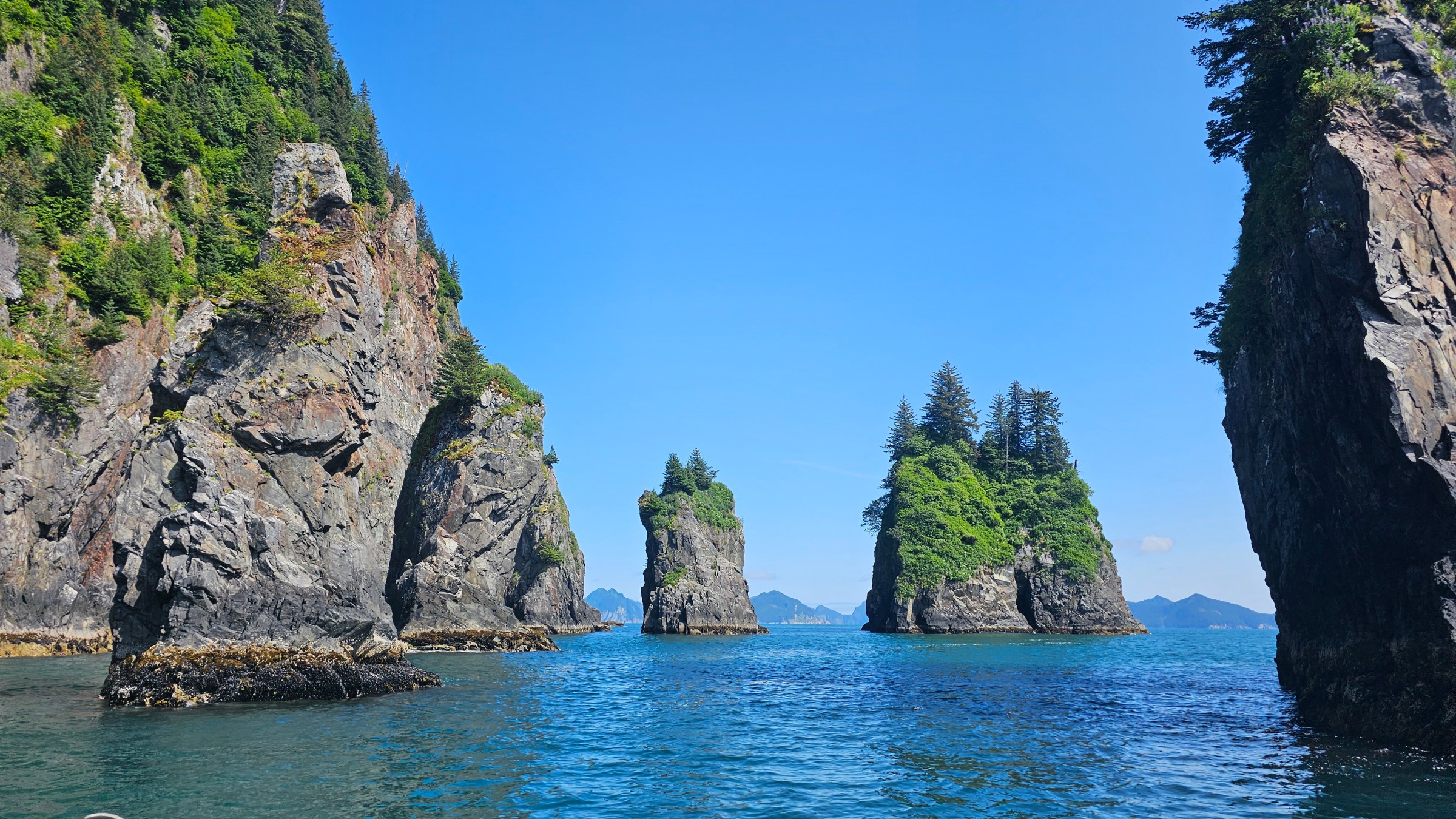 a photo of the Spire Cove with the Resurrection bay in the background