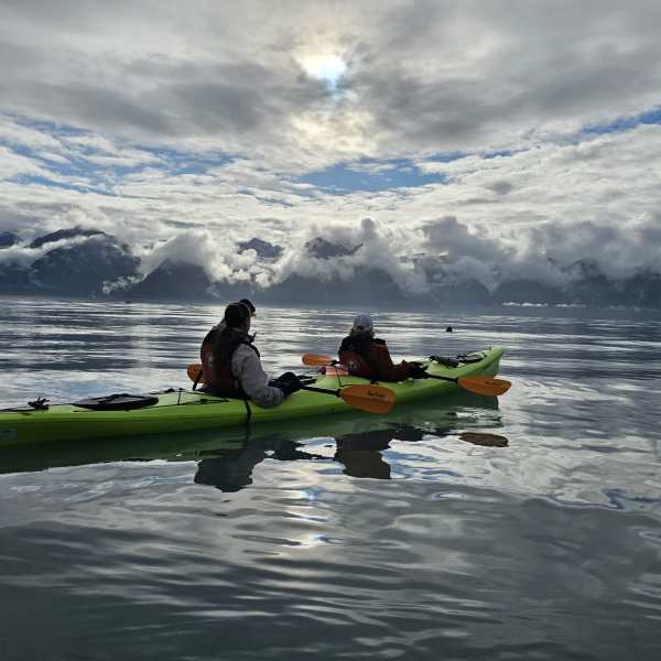 a group of people on a boat in the water