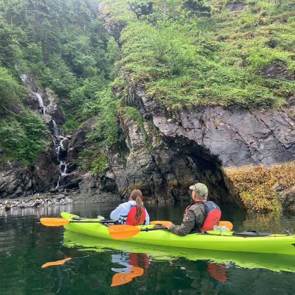 a group of people kayaking outside of Seward Alaska
