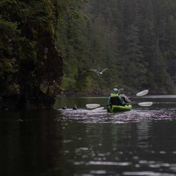 a man riding on top of a lake