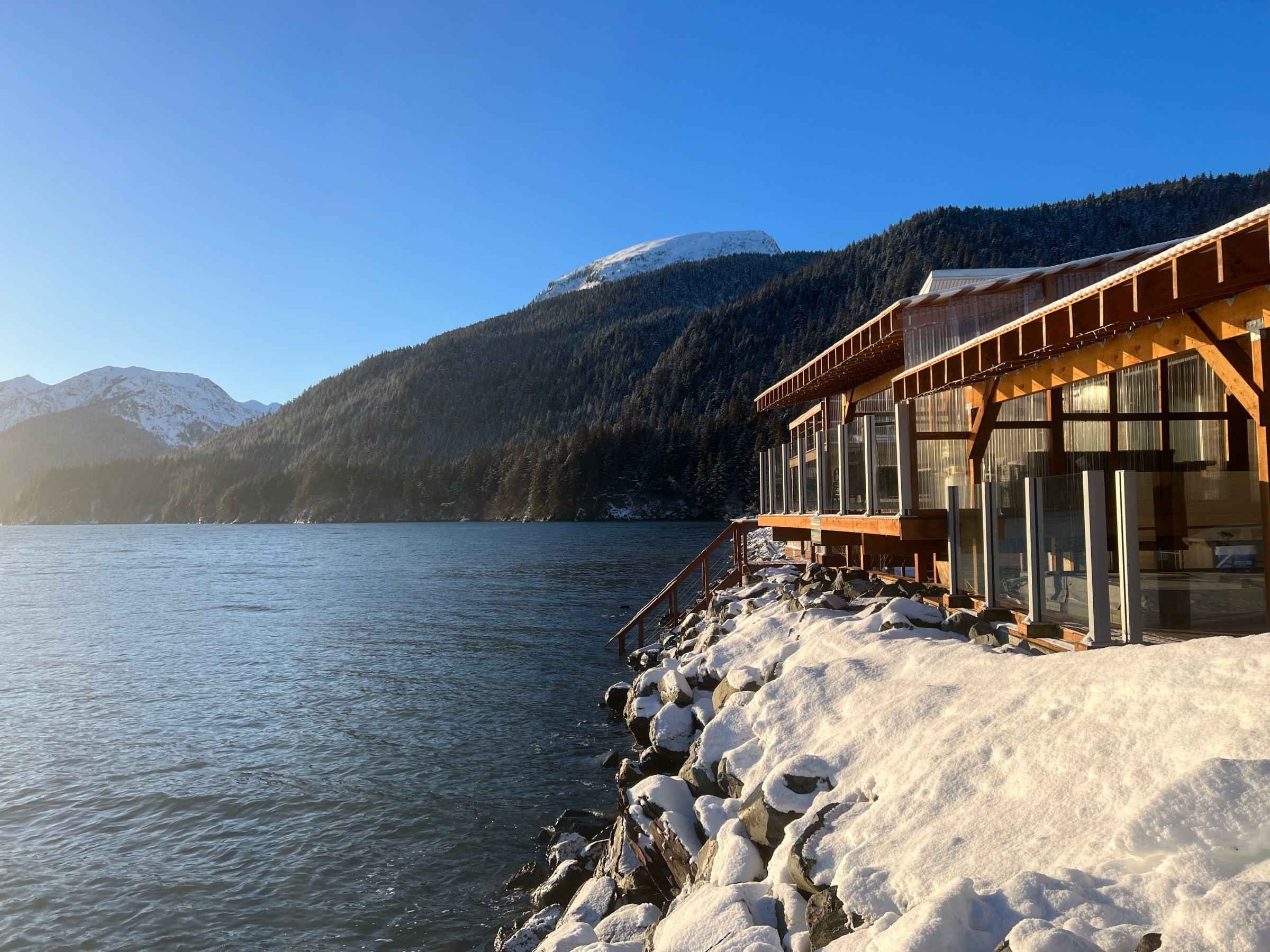 a building with a mountain in the snow