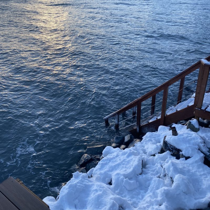 a bench next to a body of water