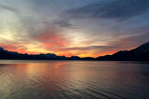 a sunset over a body of water