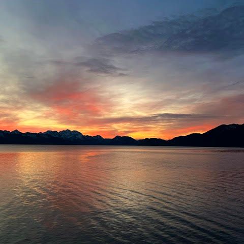 a sunset over a body of water