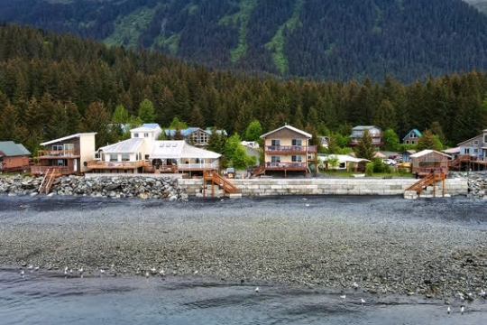 a body of water with a mountain in the background