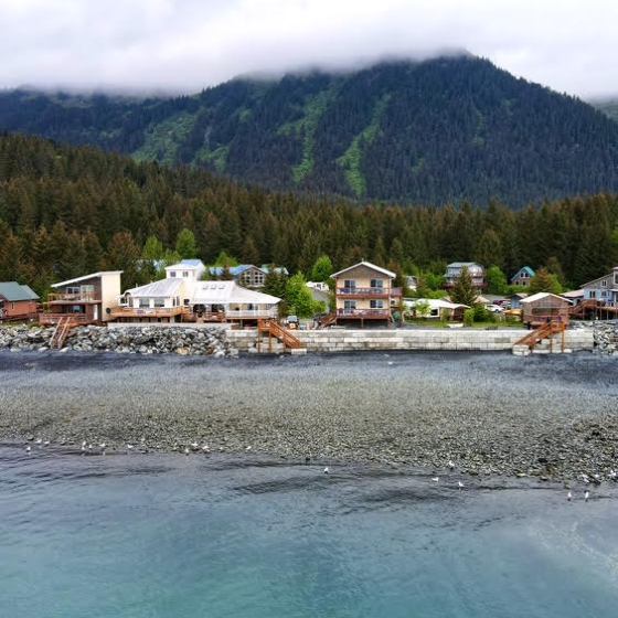 a body of water with a mountain in the background
