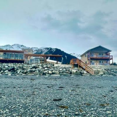 a body of water with buildings in the background