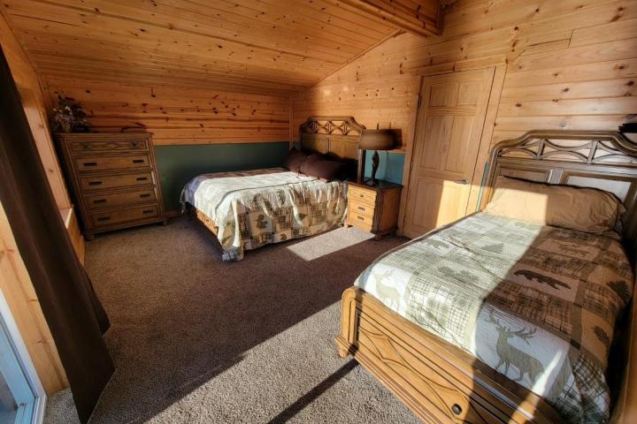 a bedroom with a bed in a room