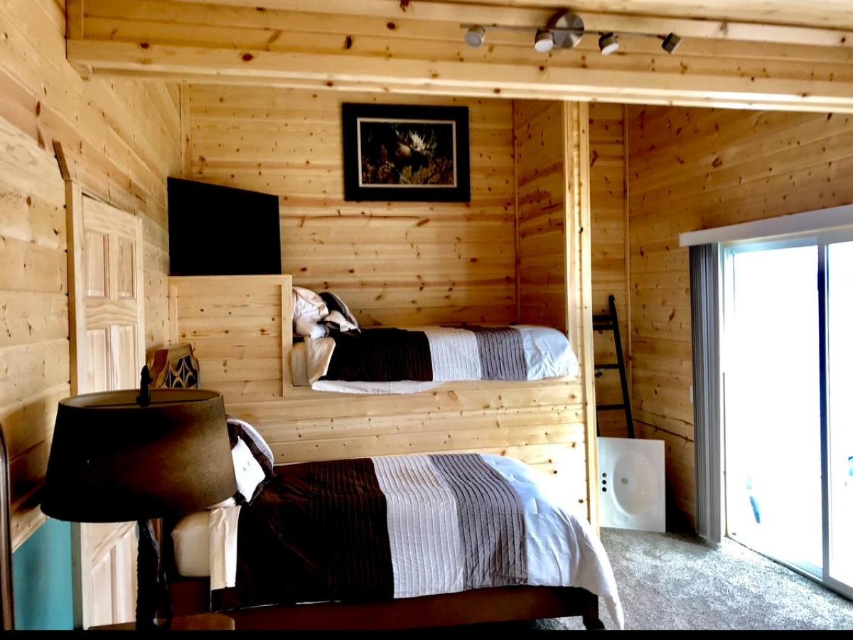 a view of a living room filled with furniture and a fireplace