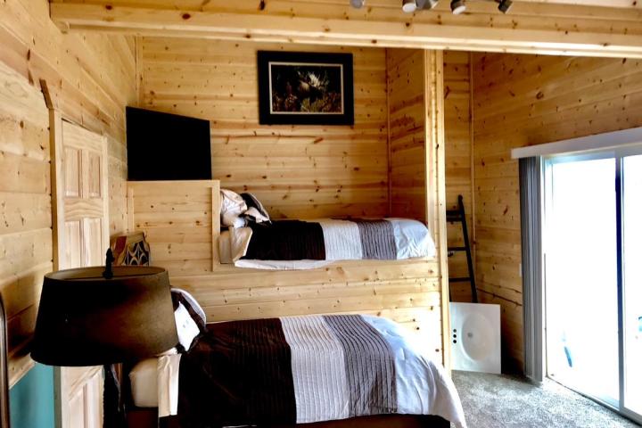 a view of a living room filled with furniture and a fireplace