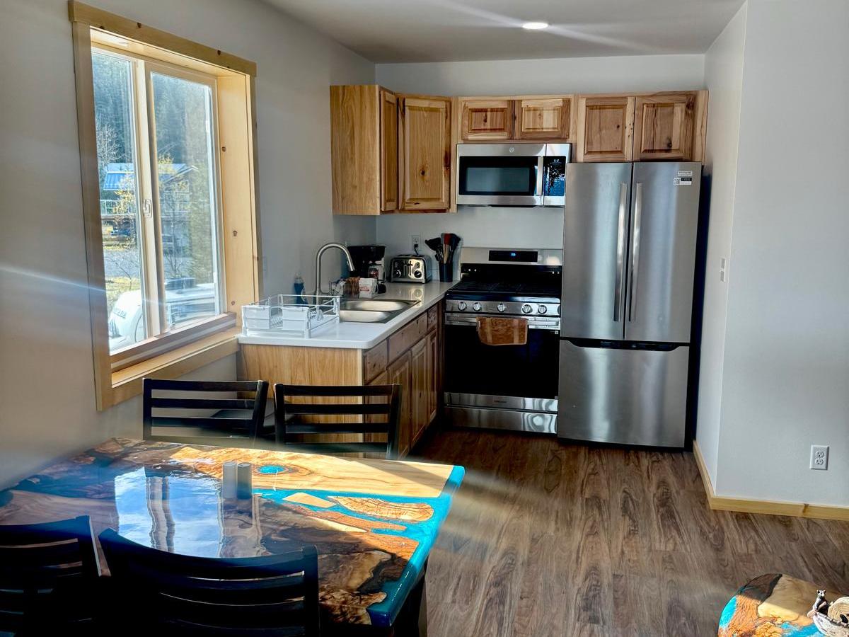 a living room filled with furniture and a large window