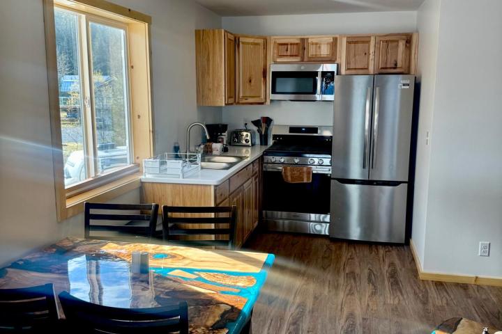 a living room filled with furniture and a large window
