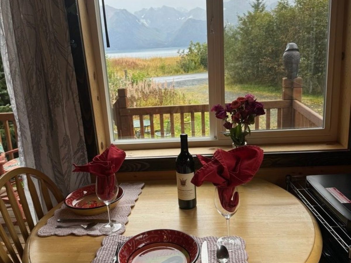 a dining room table in front of a window