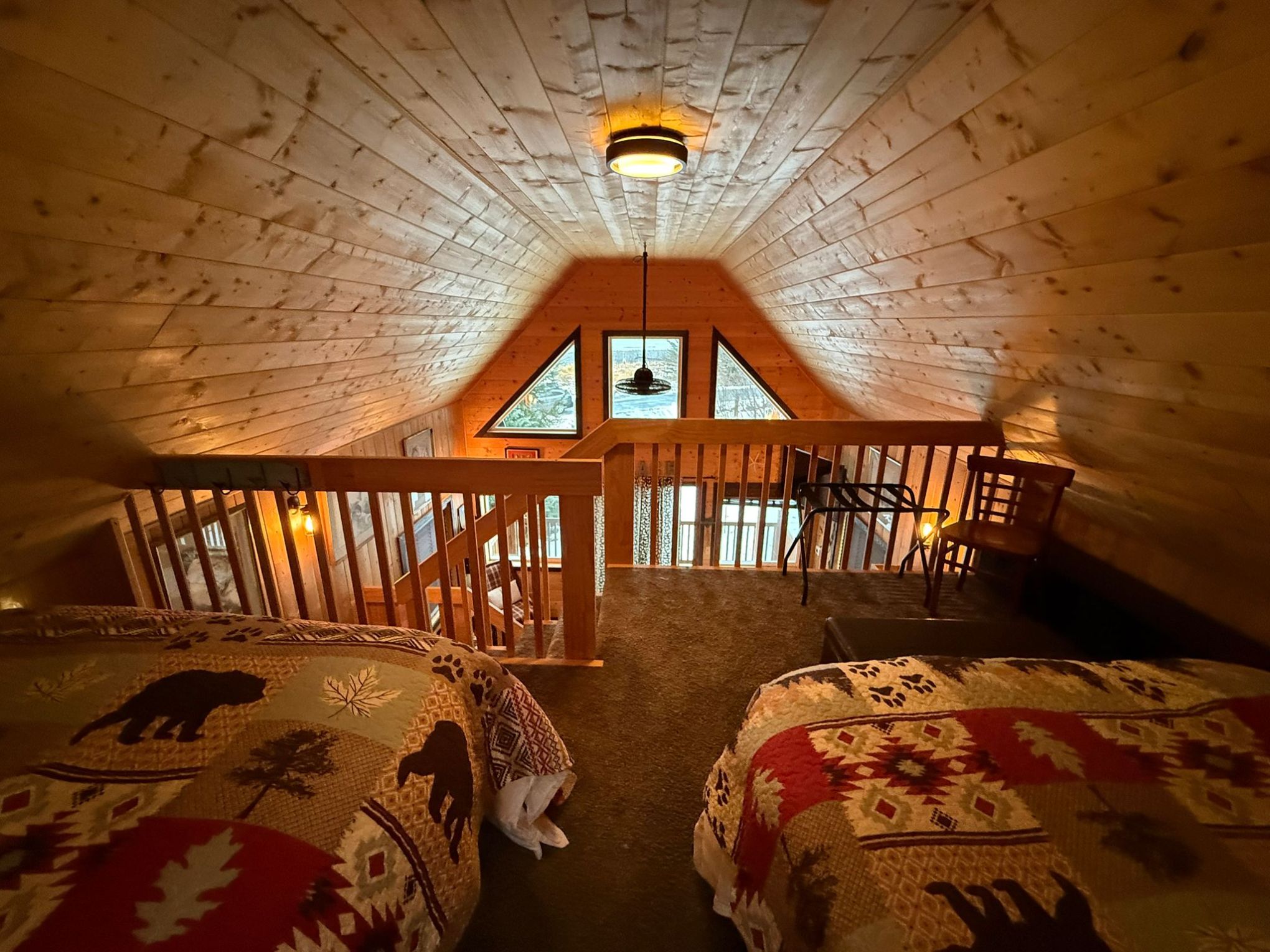 a bedroom with a bed and a chair in a room