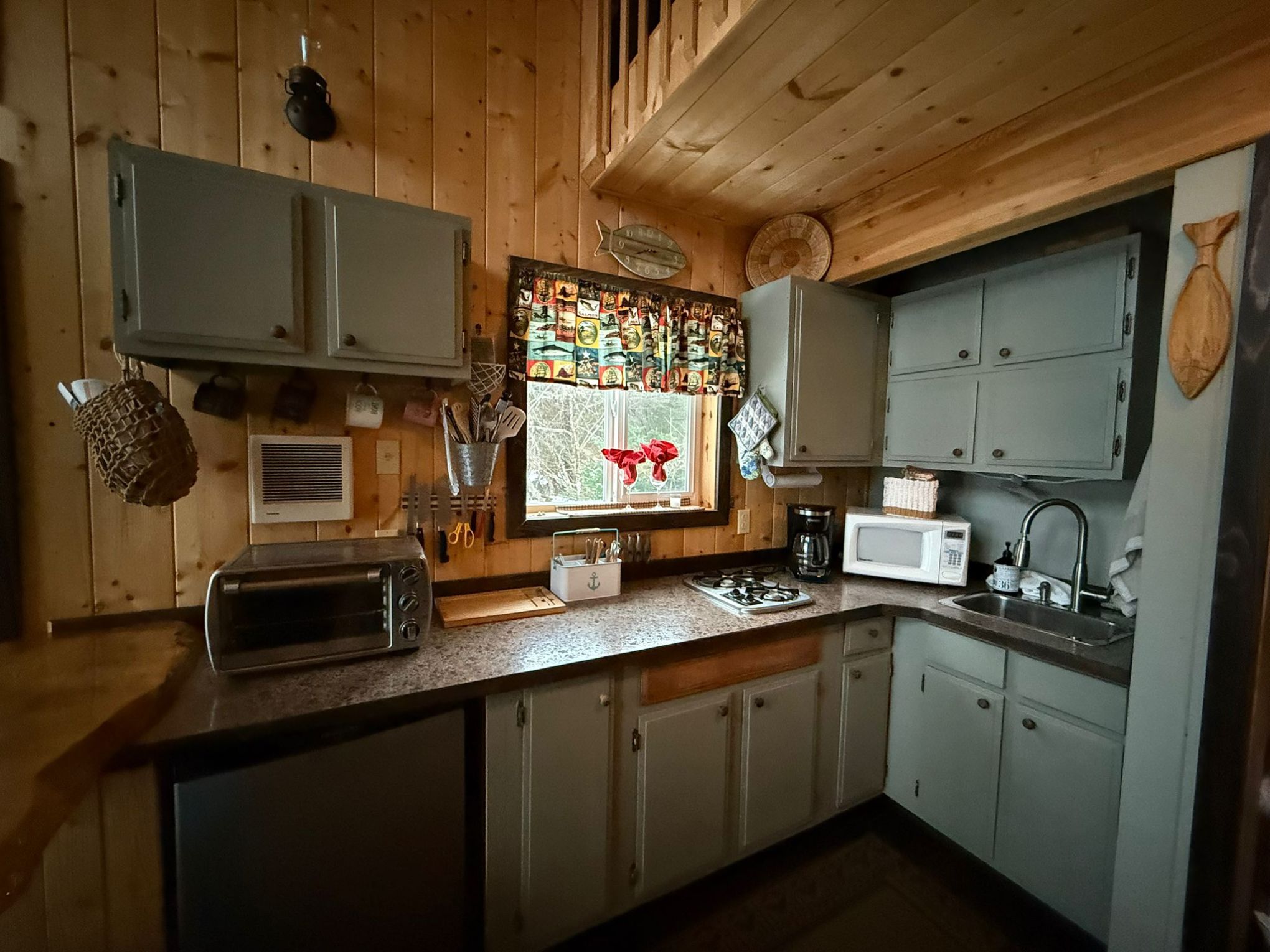 a kitchen with a stove and a sink